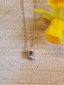initials letter D met Zirkonia Joy de la Luz